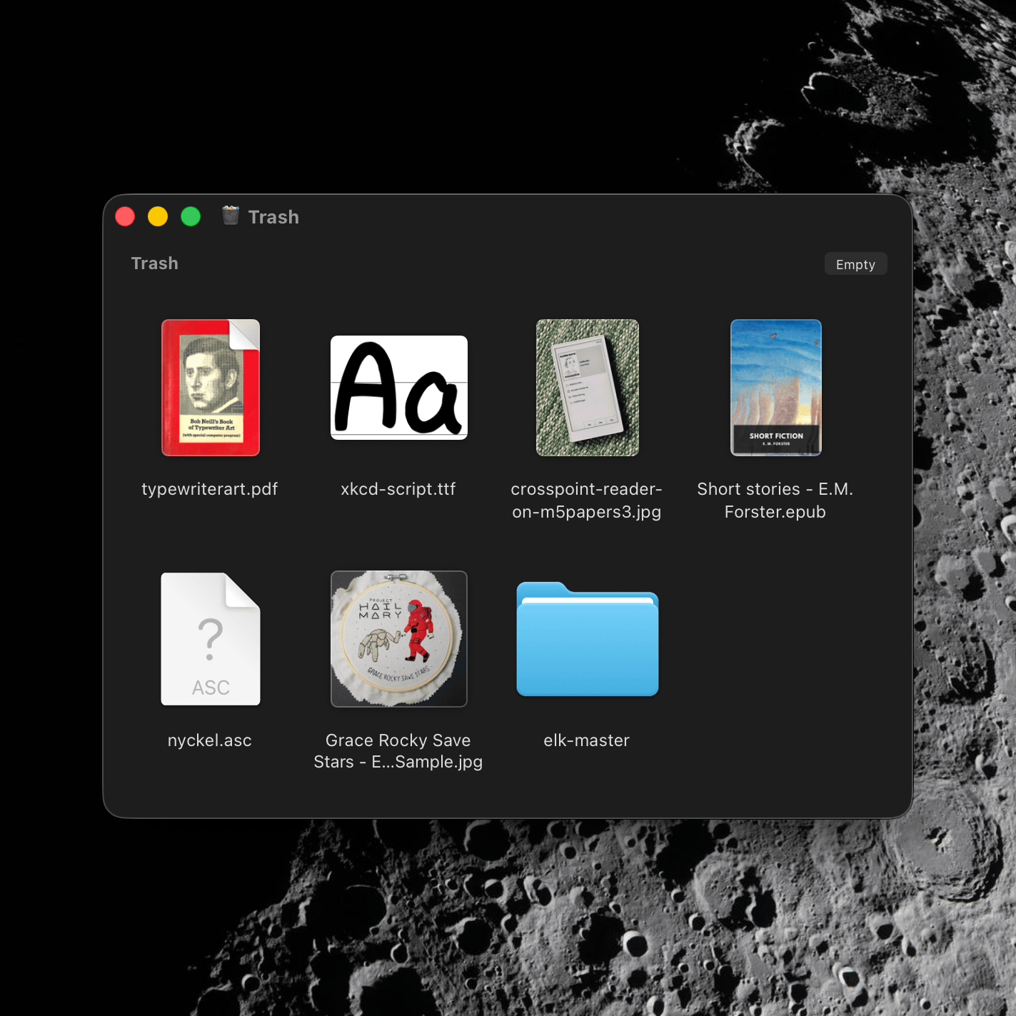 A macOS Finder window showing my trash, previewing a handful of files and one folder listed below. The Moon sits quietly in the background as my wallpaper.